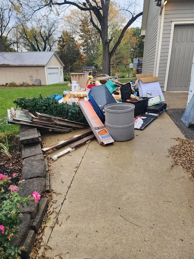 Dumpster being loaded with debris for 3 Yard Dumpster Rental in Tabor City
